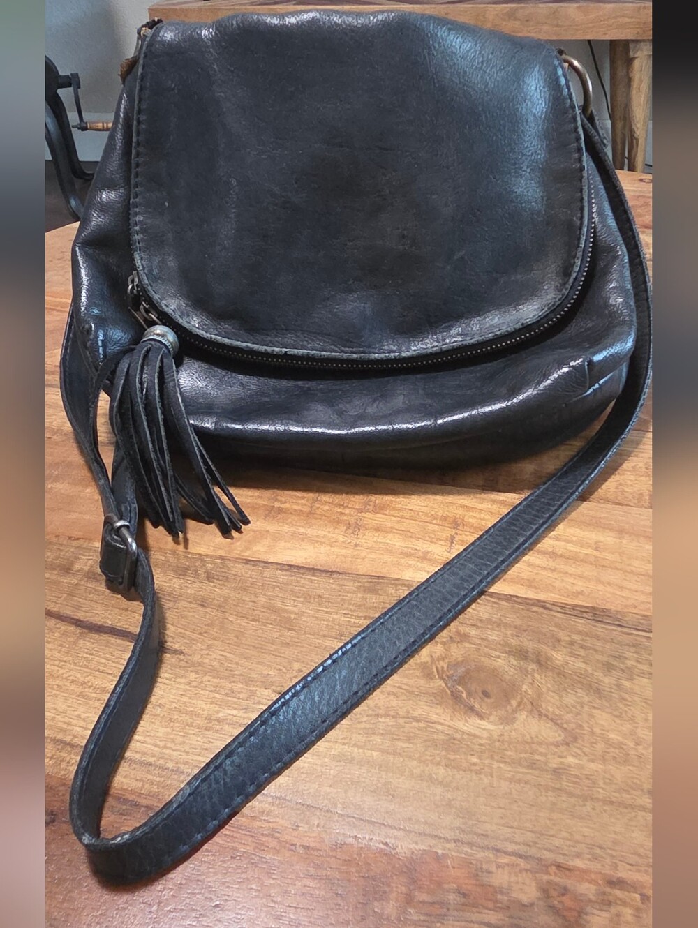 Black Leather Crossbody Bag with Tassel Accent